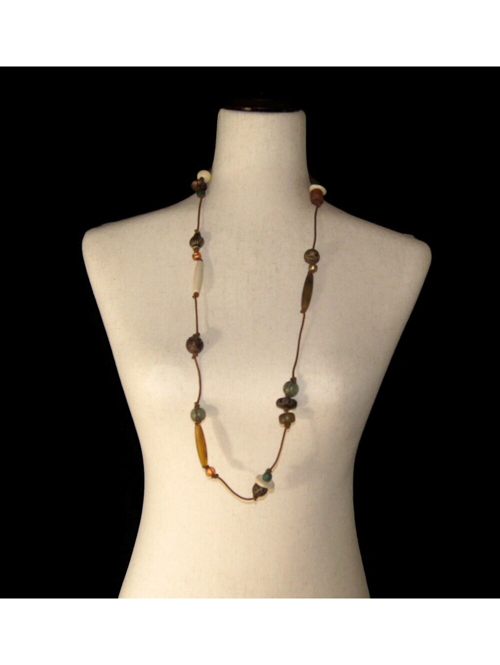 Vintage 36 Inch Plastic and Glass Multi Color Beaded Necklace on 36" Brown Cord.